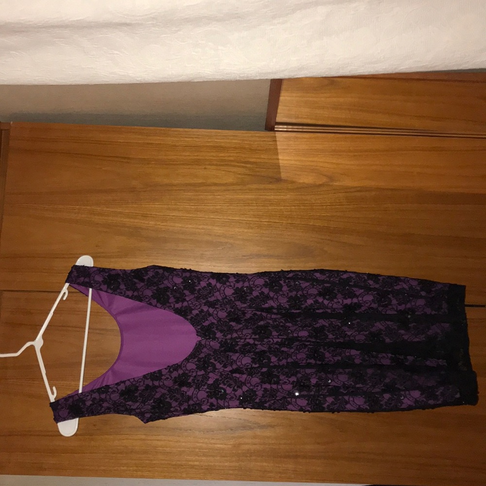 A purple dress underneath with a black over it